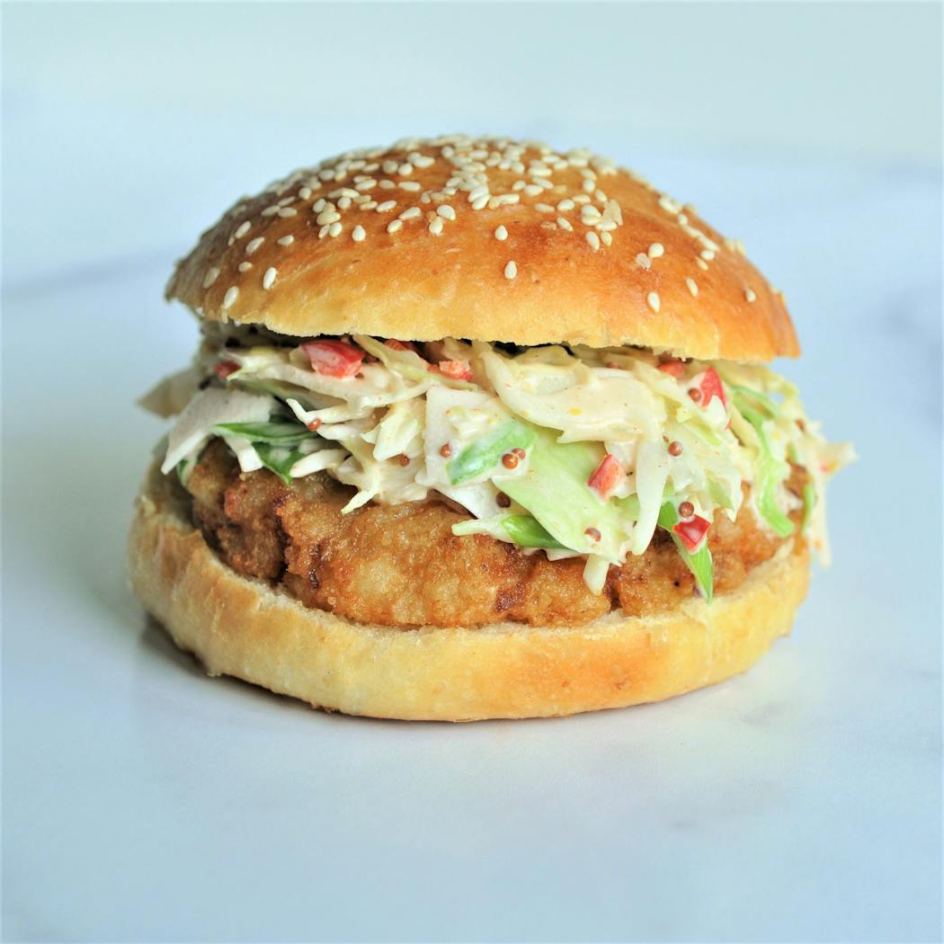 Top shrimp burgers with a spicy slaw.