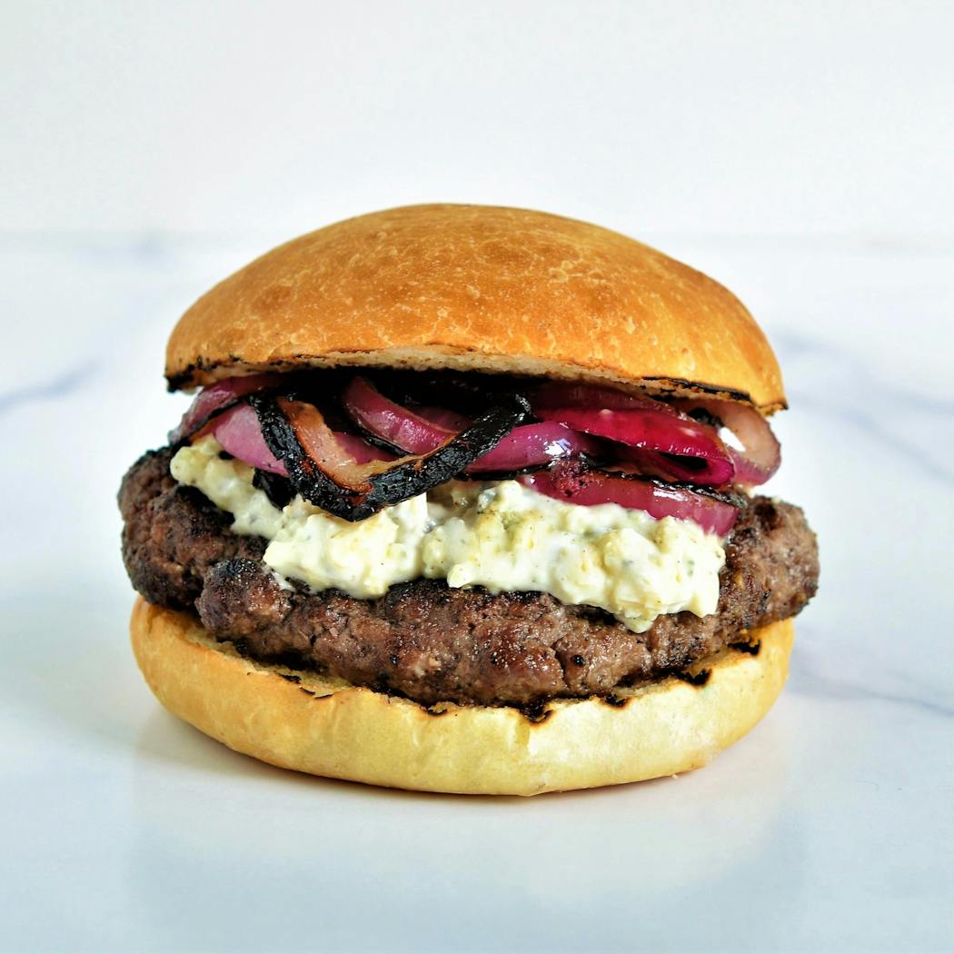 Make lamb burgers extra special with blue cheese mayo and pickled grilled red onions.