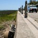 A sea wall protects homes for officers on Marine Corps Recruit Depot Parris Island. Rising seas and flooding threaten many military bases along the co