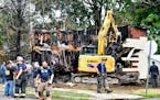 Crews worked to demolish a house that was destroyed by a fatal fire on the 700 block of 1st St. in Nescopeck, Pa., Friday, Aug. 5, 2022.
