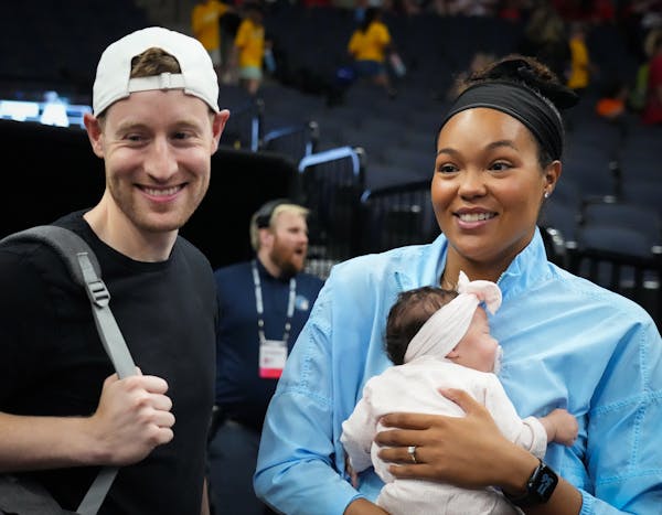 Lynx forward Napheesa Collier was with daughter Mila and fiancée Alex Bazzell during a game against Chicago on July 6.