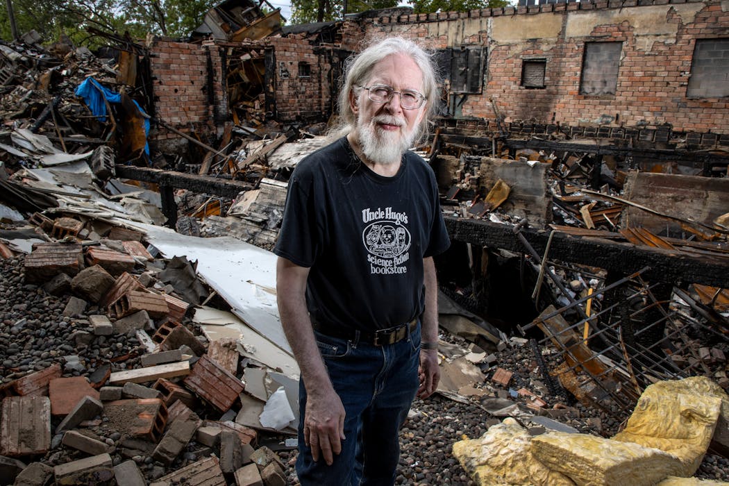 Don Blyly at the ruins of Uncle Hugo’s Science Fiction Bookstore and Uncle Edgar’s Mystery Bookstore in Minneapolis in August 2020. His new shop may open as soon as next week.