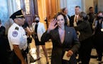 Vice President Kamala Harris waves as she departs the Senate after the passage of the Inflation Reduction Act at the U.S. Capitol on August 7, 2022, i