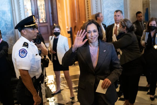 Vice President Kamala Harris waves as she departs the Senate after the passage of the Inflation Reduction Act at the U.S. Capitol on August 7, 2022, i