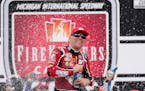 Kevin Harvick celebrates after winning the NASCAR Cup Series auto race at the Michigan International Speedway in Brooklyn, Mich., Sunday, Aug. 7, 2022