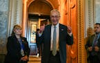 Senate Majority Leader Chuck Schumer (D-N.Y.) gave two thumbs up after Democrats passed a climate, tax and health care spending package on Capitol Hil