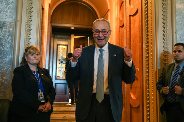Senate Majority Leader Chuck Schumer (D-N.Y.) gave two thumbs up after Democrats passed a climate, tax and health care spending package on Capitol Hil