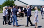 President Joe Biden and first lady Jill Biden are greeted by Kentucky Gov. Andy Beshear, as they arrive at Wendell H. Ford Airport Landing Zone, Monda