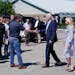 President Joe Biden and first lady Jill Biden are greeted by Kentucky Gov. Andy Beshear, as they arrive at Wendell H. Ford Airport Landing Zone, Monda