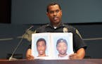 At a news conference Monday, Bloomington Police Chief Booker Hodges held up photos of Shamar Alon Ramon Lark, left, and Rashad Jamal May, sought in co