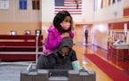 Elliana Mulari, 3, sat atop her dad Timothy’s shoulders as he voted at the Farview Park Recreation Center polling location in north Minneapolis on T