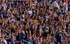 Fans do the Skol Chant at an evening practice during Minnesota Vikings training camp at TCO Stadium.