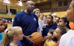 Former Gophers basketball player Clyde Turner gathered a group of kids attending his basketball camp in Brooklyn Center in 2001.