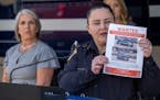 Albuquerque Police Deputy Chief of Investigations Cecily Barker holds a flyer with photos of a car wanted in connection with Muslim men murdered as Go