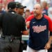 Twins manager Rocco Baldelli argued with umpires Marty Foster, left, and Alan Porter after a review reversed a out call at the plate in the 10th innin