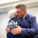 GOP congressional candidate Brad Finstad hugged his mother, Sharon Finstad, at Tuesday night’s election party in Sleepy Eye, Minn.