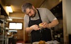 Adam Vickerman shredded Parmesan on a serving of Tagliatelle with Short Rib Ragu at his Linden Hills restaurant, Tosca.
