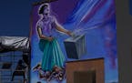 Mexican mural artist Yanet Calderon paints a mural in San Salvador, Mexico, Saturday, July 30, 2022.