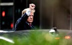 Former President Donald Trump gestured as he left Trump Tower in New York City on Wednesday on his way to the New York attorney general’s office.