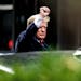 Former President Donald Trump gestured as he left Trump Tower in New York City on Wednesday on his way to the New York attorney general’s office.