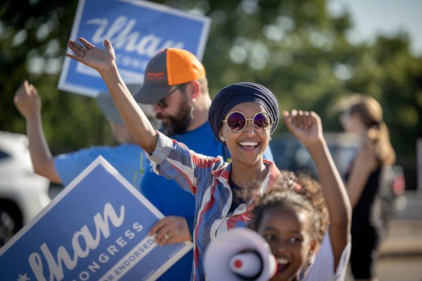 U.S. Rep. Ilhan Omar waved to passersby for support during a voter engagement event on the corner of Broadway and Central Avenue in Minneapolis on Tue