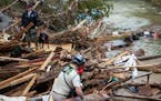 Rubble atop Troublesome Creek in Perry County in Kentucky after flash floods killed at least 28 people and left dozens missing.
