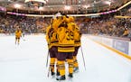 Gophers players celebrated a goal at 3M Arena at Mariucci in 2021.