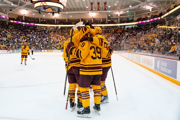 Gophers players celebrated a goal at 3M Arena at Mariucci in 2021.