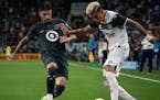 DC United forward Taxiarchis Fountas battles it out with Liga MX defender Luis Reyes in the second half 