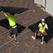 Workers with Power Shift Solar put solar panels on a house Wednesday, Aug. 10, 2022, in Salt Lake City.