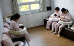 Mothers breastfeed at a postnatal care center in Haenam, South Korea, in 2015. By some metrics, the country has the best health care system in the wor