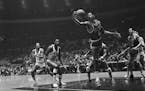 The late Bill Russell of the Boston Celtics grabbed a rebound during the NBA Eastern Division Finals against the New York Knicks at Madison Square Gar