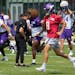 Minnesota Vikings quarterback Kirk Cousins (8) warms up with his teammates during training camp Tuesday, Aug. 2, 2022 at the TCO Performance Center in