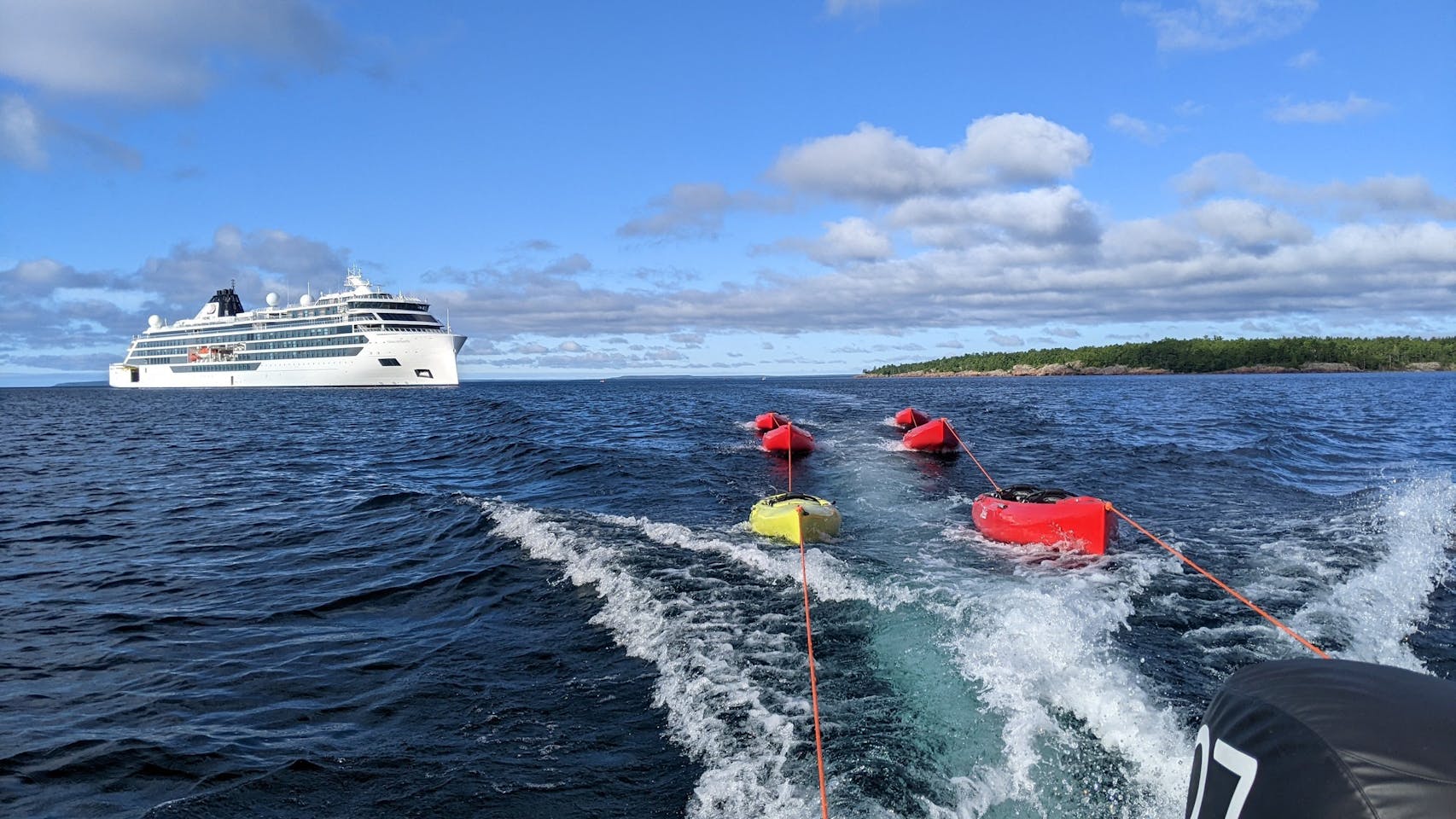 Kayaks trailed behind a Zodiac boat during an expedition from the cruise ship Viking Octantis in Lake Huron’s Georgian Bay near Killarney, Ontario.