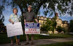 Lois Maciej and Ren Holland stand outside Hurrle Hall, which they have been fighting to save from demolition. The historic 1891 building on the Franci