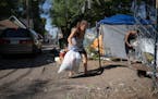 Shawnie collected trash from the south Minneapolis encampment she calls home. Shawnie said she had previously lived at a nearby encampment that the ci