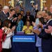 Speaker Nancy Pelosi (D-Calif.), center, and members of the U.S. House of Representatives celebratee during an enrollment ceremony for the Inflation R