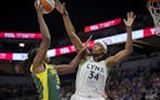 Lynx center Sylvia Fowles (34) blocks a shot from Seattle’s Tina Charles during the second quarter.