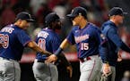 Twins third baseman Gio Urshela (15) celebrated with teammates after Friday night’s 4-0 victory over the Angels.