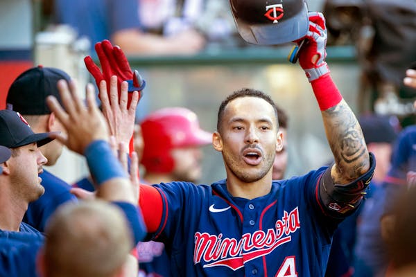 Shortstop Carlos Correa, one of three active Puerto Rican players on the Twins roster, got high fives from his teammates after hitting a solo home run