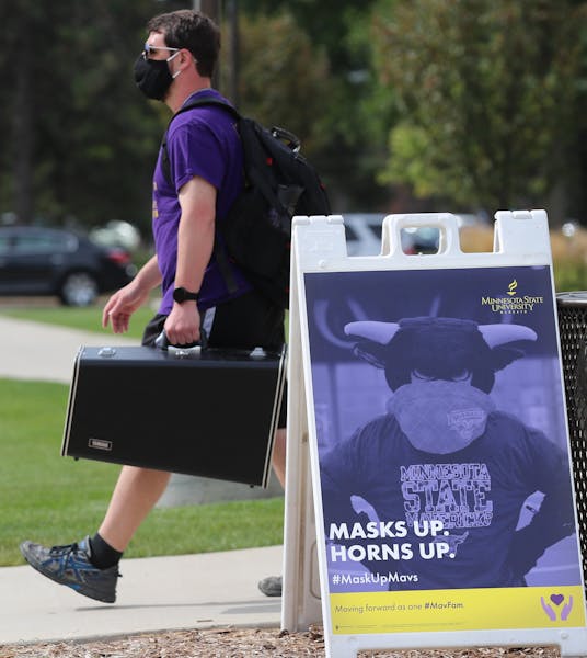 Students began moving into dormitories at Minnesota State University-Mankato on Aug. 20, 2020, where signs on campus reminded students to wear masks t