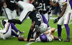 Minnesota Vikings quarterback Sean Mannion is sacked by Las Vegas Raiders defensive end Gerri Green during the first half of an NFL preseason football