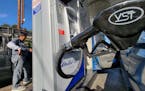 A motorist pumps gasoline at United Oil gas station in Los Angeles Friday, Aug. 12, 2022. The average U.S. price of regular-grade gasoline plummeted 4