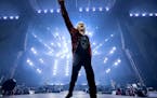 Joe Elliott of Def Leppard greeted nearly 50,000 fans who waited more than two years for Sunday’s concert at U.S. Bank Stadium with Mötley Crüe.