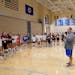 Wayzata volleyball coach Scott Jackson filled in his players on the routine for Monday, the first day of practices for fall sports.