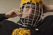 Eveleth star player Elliot Van Orsdel prepares to do battle in “Hockeyland.”