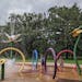 Plainville residents Sasha Fallon, 6, and Chelsea Fallon, 10, and St. Cloud resident Shay Fallon, 7, from left to right, play at the splash pad on Mon