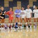 Wayzata girls’ volleyball players looked on as teammate Stella Swenson, third from left, ran backwards during a drill Monday.