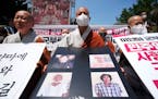 South Korean Buddhist monks stage a rally against Myanmar’s military coup in front of the Myanmar Embassy in Seoul, South Korea, Thursday, July 28, 
