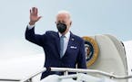 President Joe Biden waves as he boards Air Force One at the Charleston Air Force Base in Charleston, S.C., Tuesday, Aug.16, 2022, to travel to the Whi